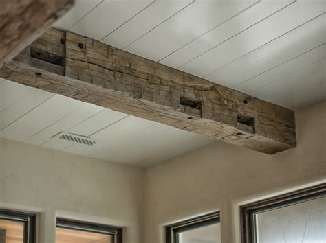 installing real wood ceiling beams.